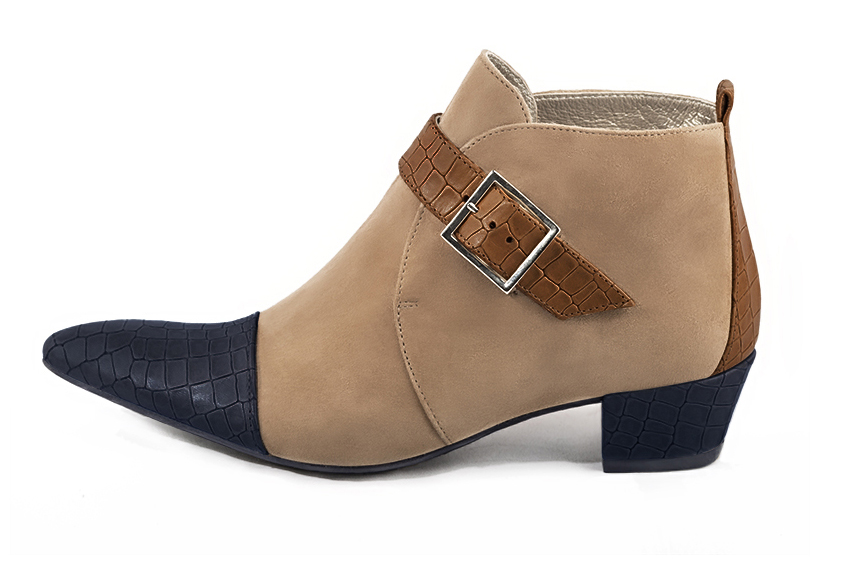 Women's navy blue, tan beige and caramel brown elegant ankle boots, with buckles at the front. Tapered toe. Low cone heels - Profile view
